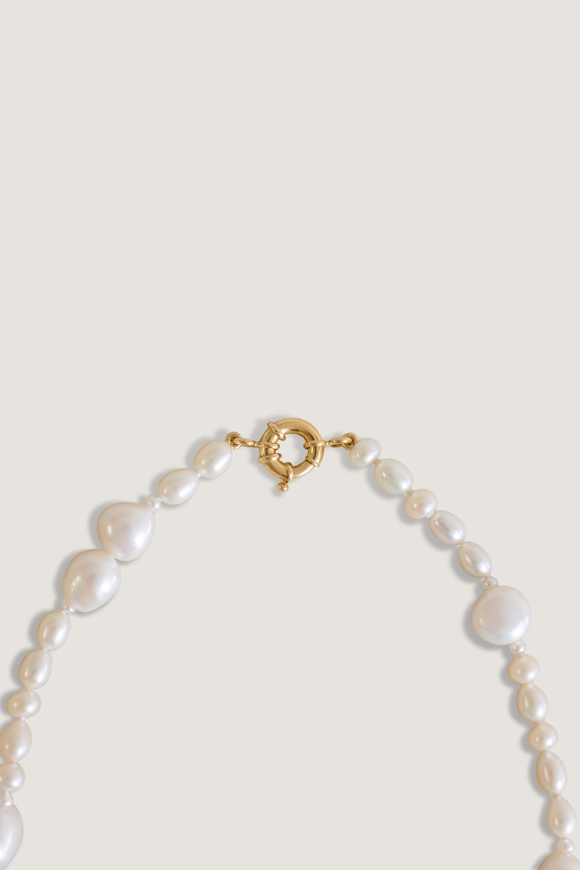 Close up of the clasp on the Kinn Studio 14k Gold Lucy Baroque Pearl Necklace