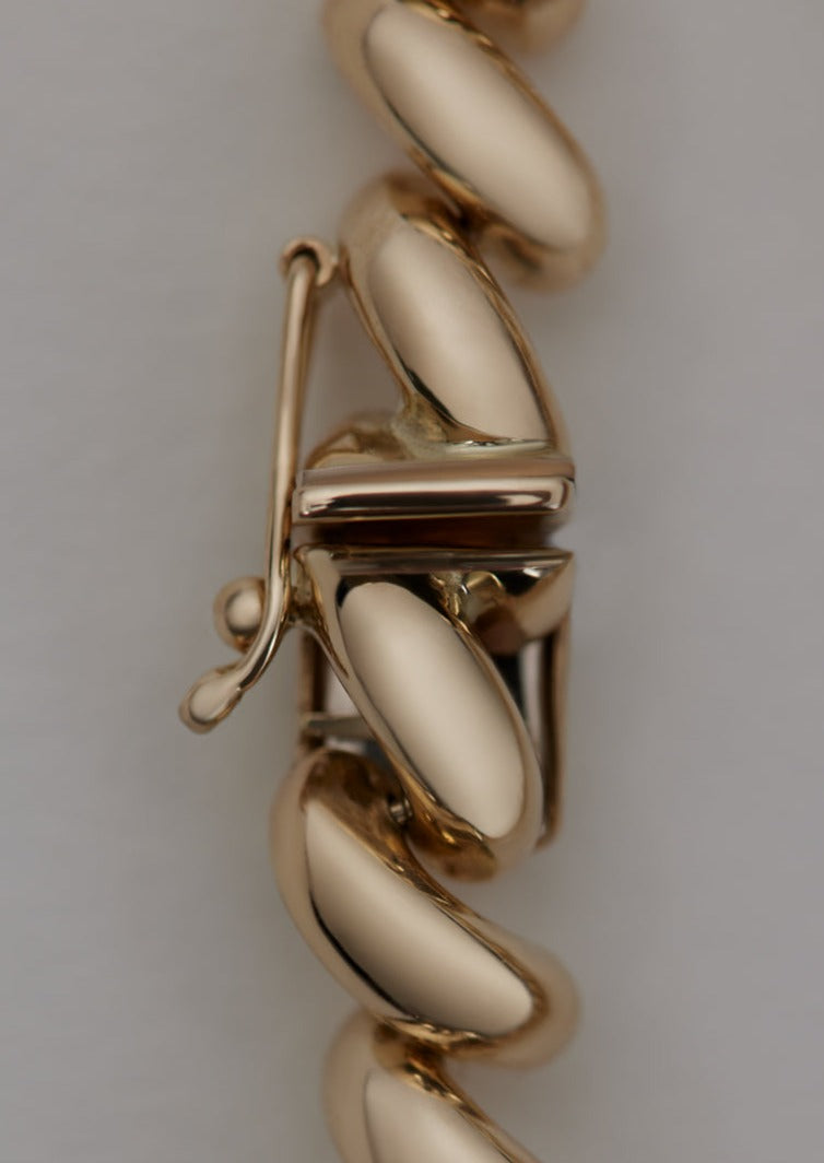 close up of the safety box clasp of a Kinn Studio 14k Gold Hampshire House Bracelet