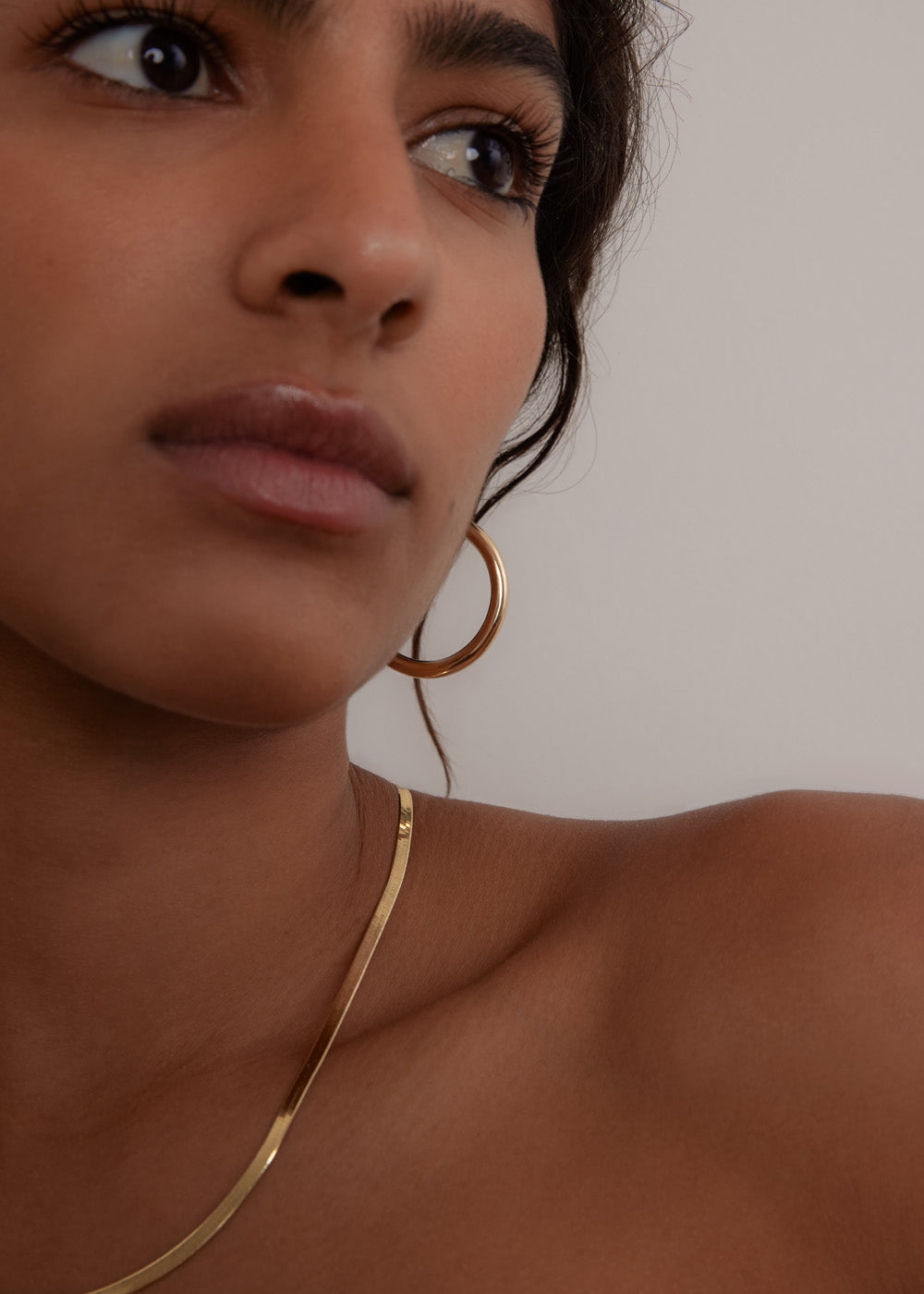 alt="Carter Herringbone Chain II & Large Classic Hoop Earrings Stack"