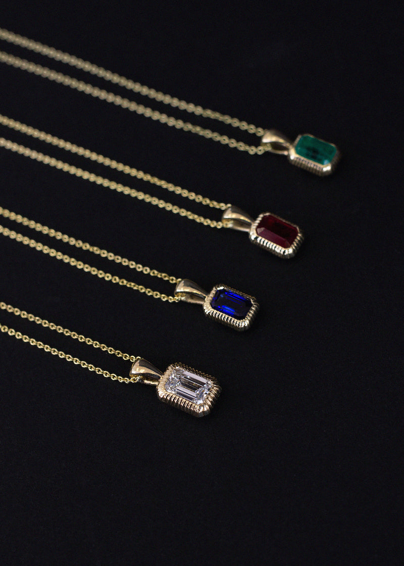 alt="Lyra Baguette Pendant Emerald"