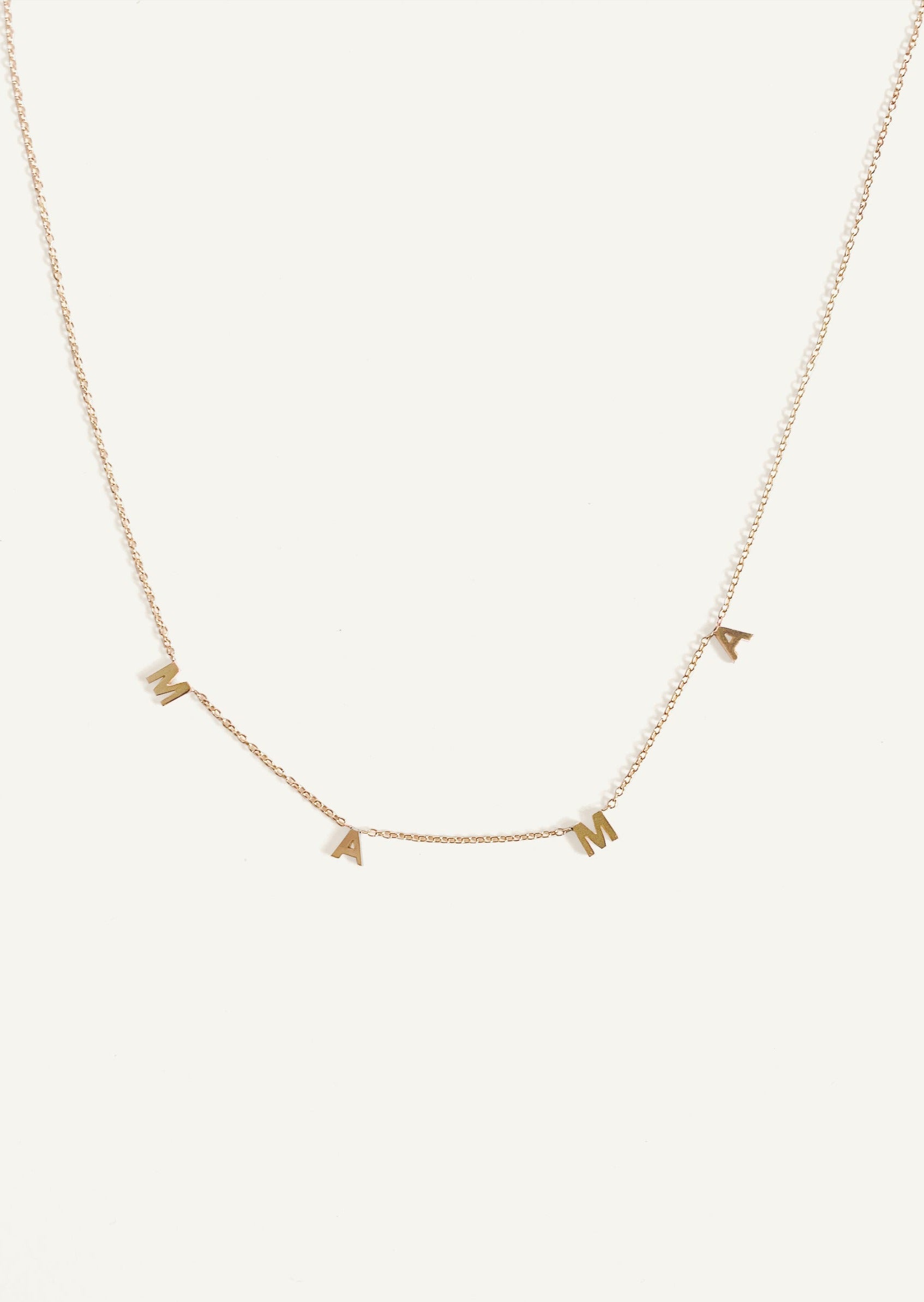 alt="Dear Kaia Initial Necklace 'mama'"