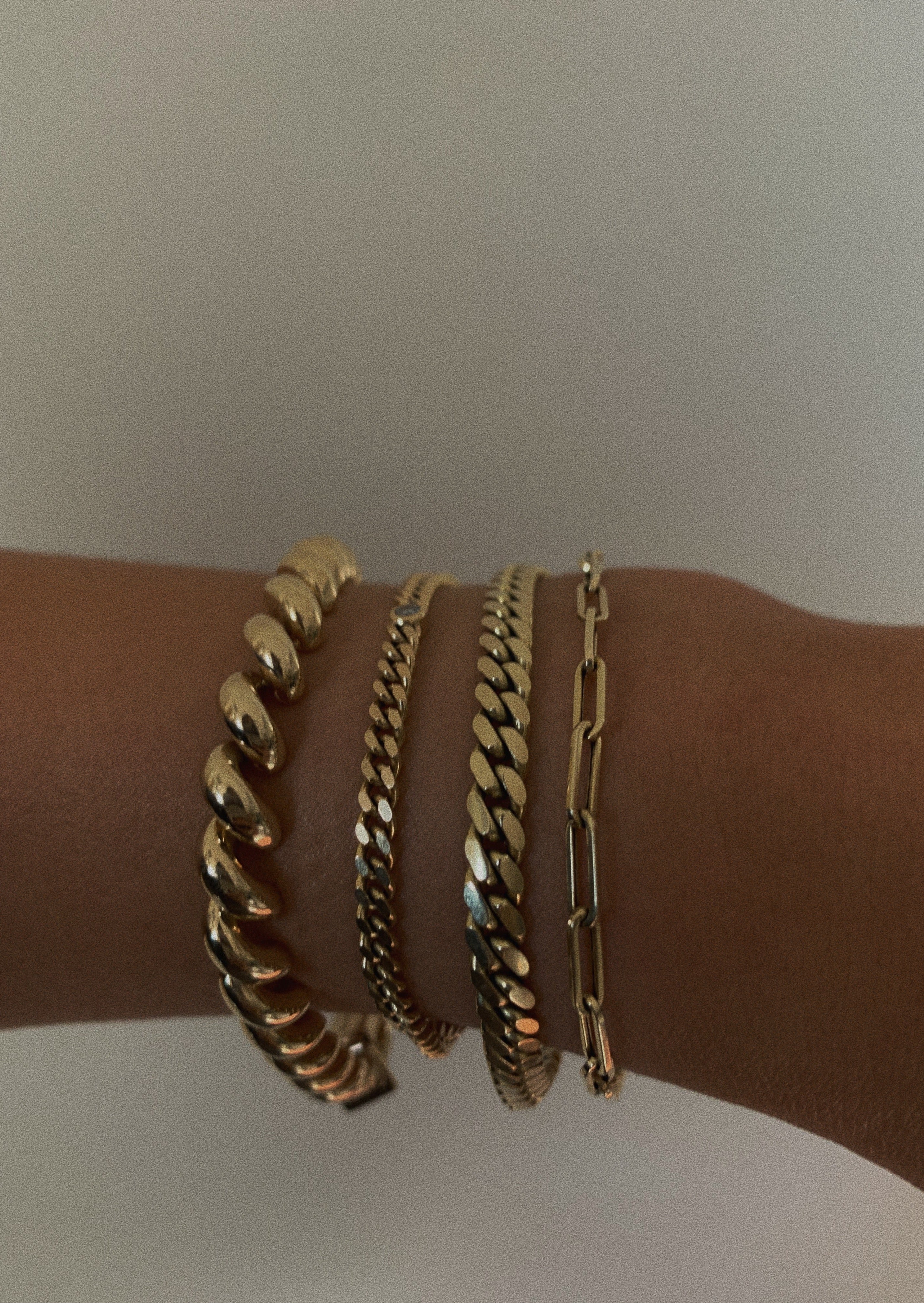 alt="Capri Curb Diamond Bracelet with Hampshire House Bracelet and Petite Link Chain Bracelet"