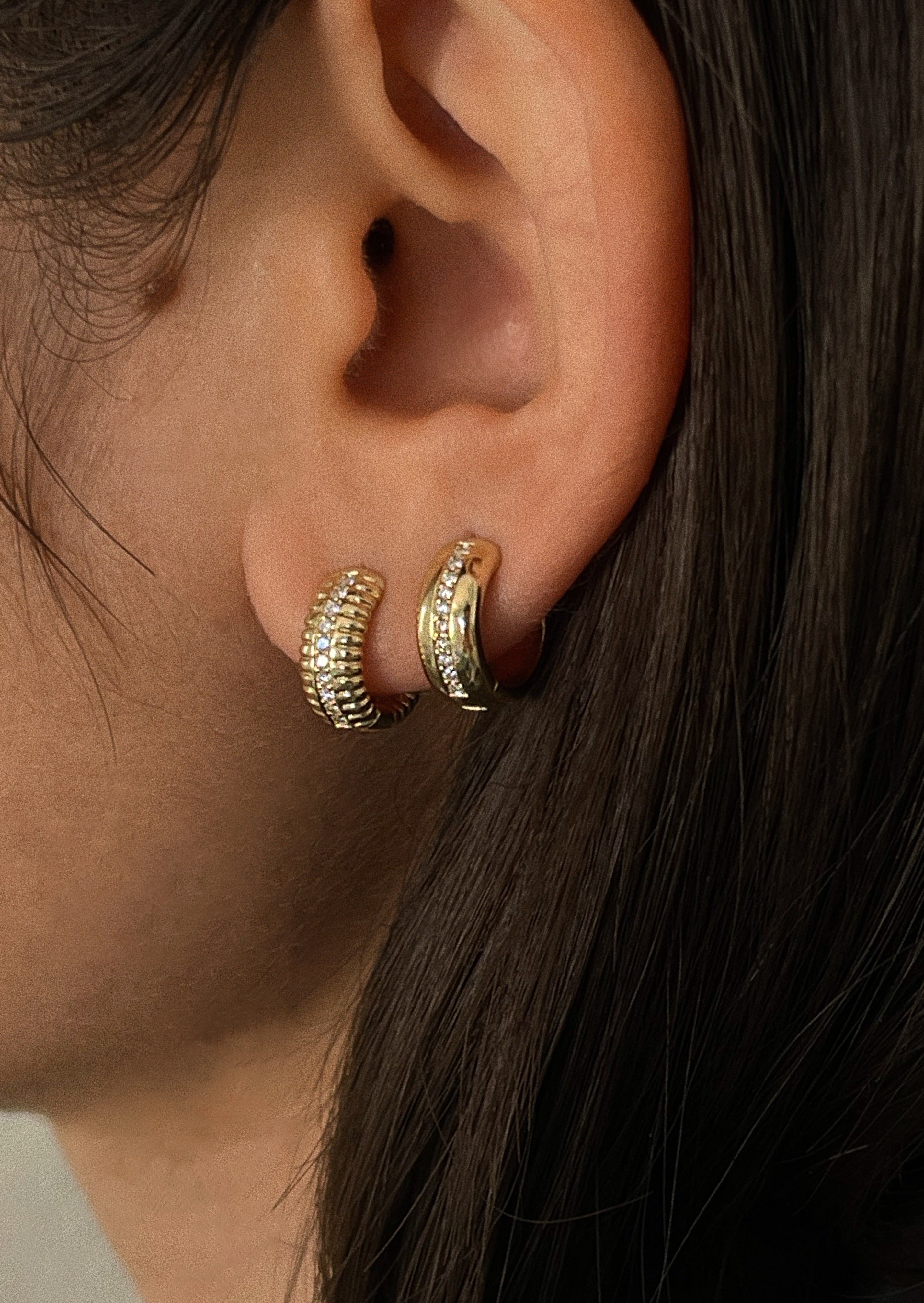 alt="Solis Ribbed Pavé Earrings and ynez pave huggies"